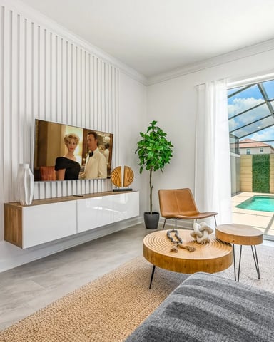 Resort home living room with screened pool view