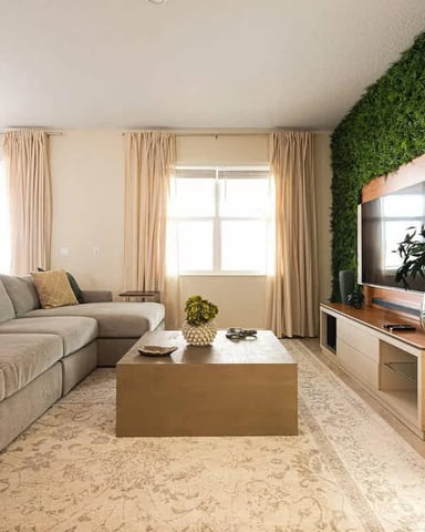 Spacious living room with moss wall feature